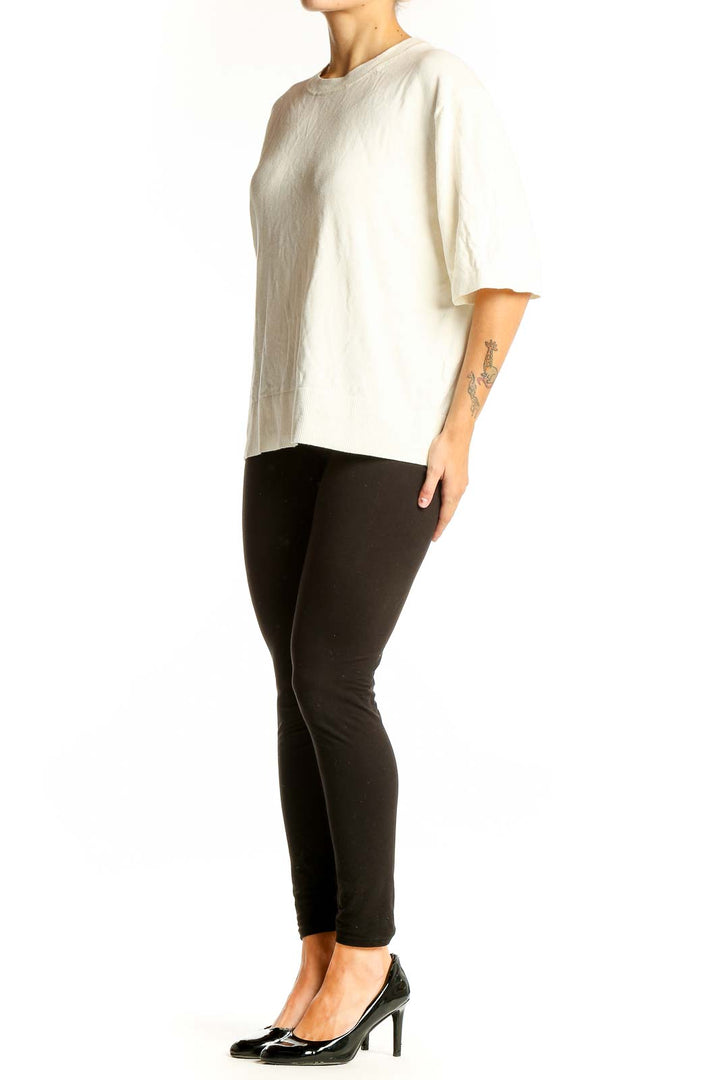 Front view of cream oversized short-sleeve knit top from Banana Republic