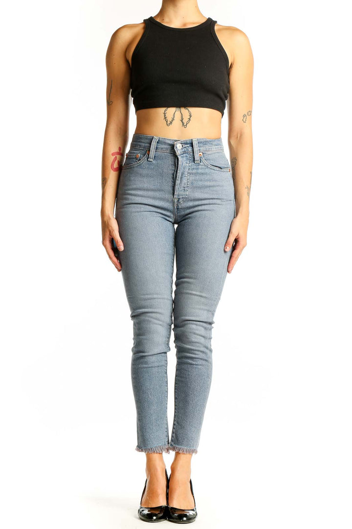 Front view of Levi's light blue high-waisted skinny jeans on model