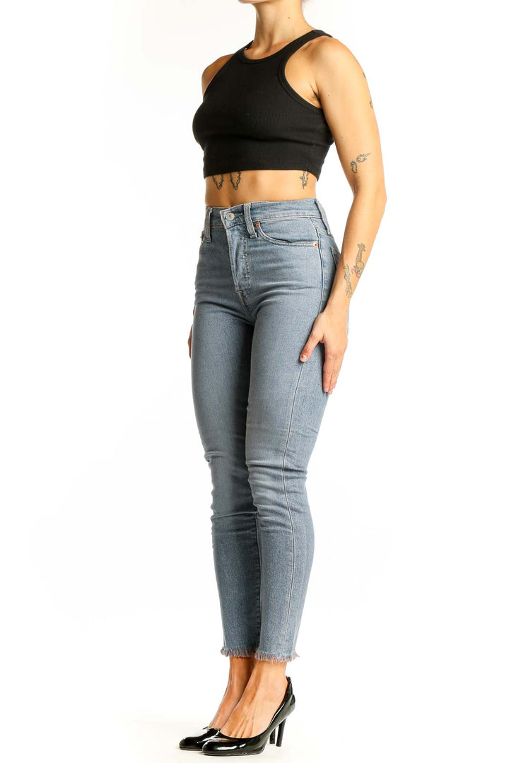 Front view of Levi's light blue high-waisted skinny jeans on model