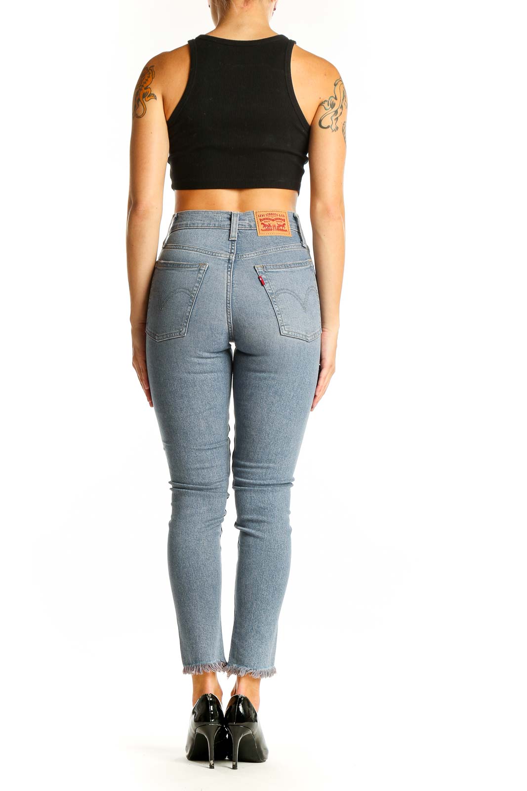 Side view of Levi's light blue high-waisted skinny jeans on model