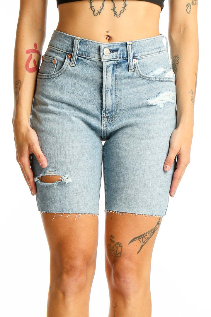 Front view of Gap light blue distressed denim Bermuda shorts