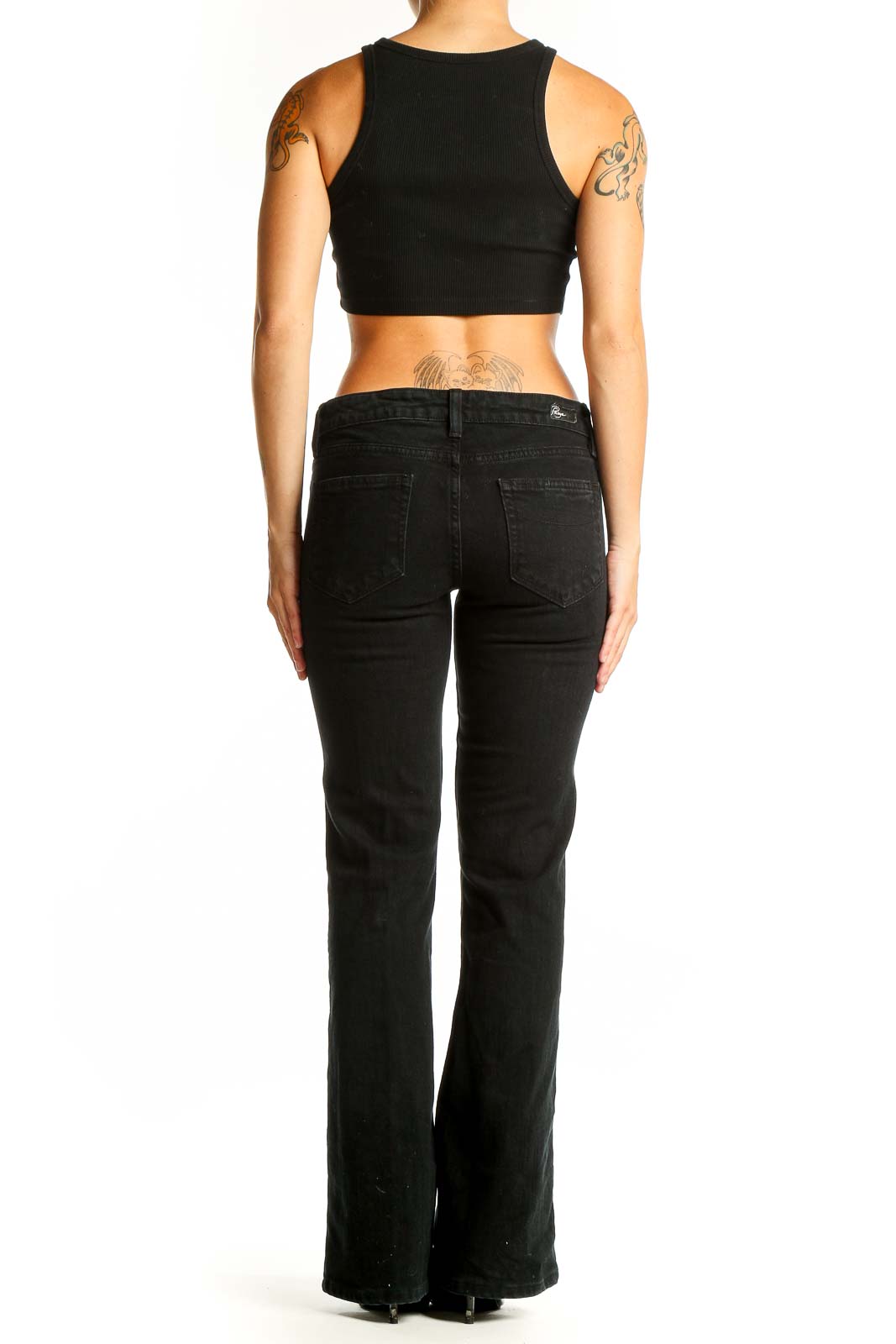 Back view of Paige black slim fit bootcut jeans on model
