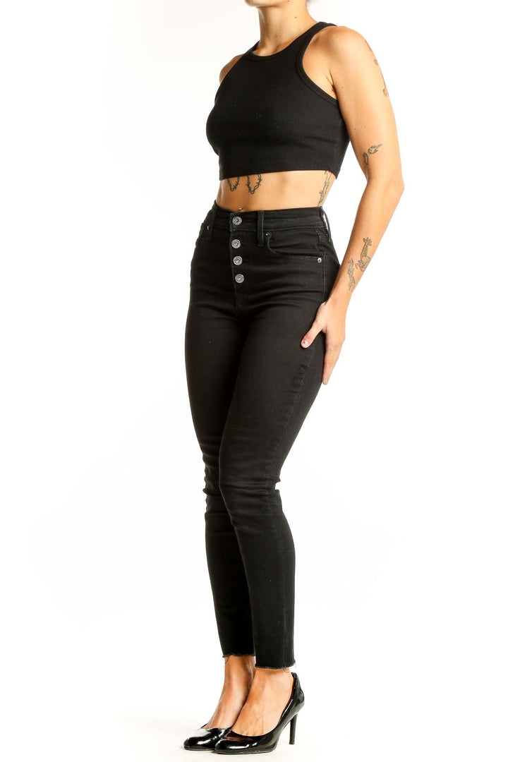 Front view of Levi's black high-waisted skinny jeans with button-fly