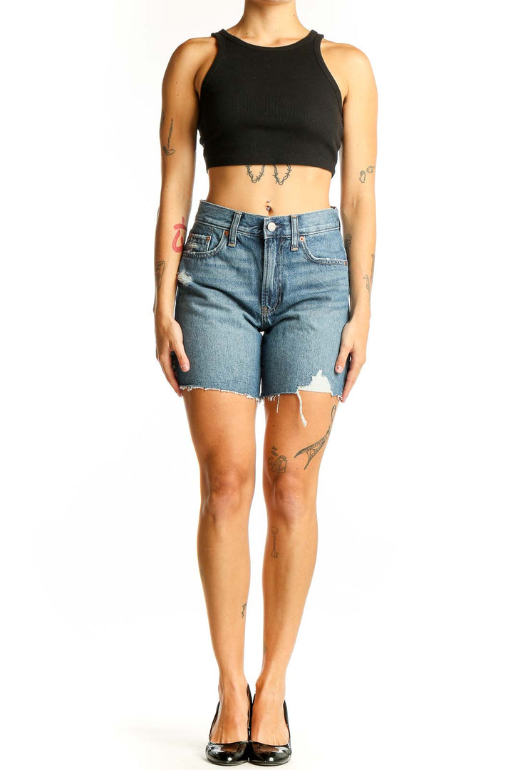 Front view of Gap blue distressed denim shorts with raw hem