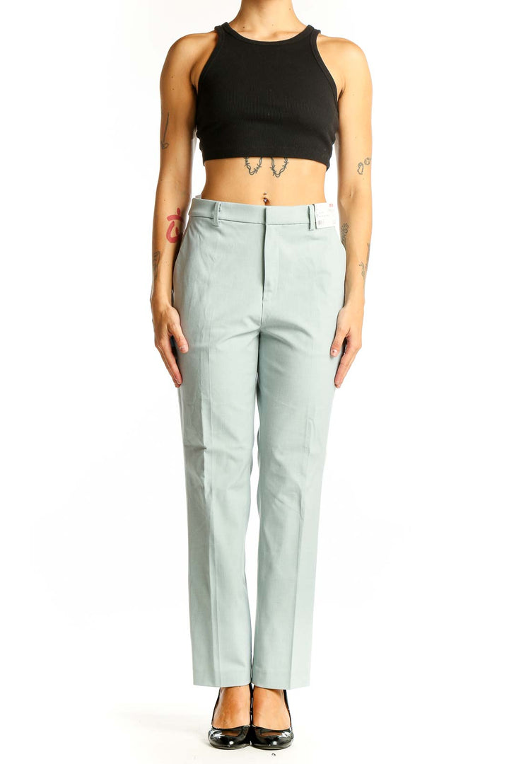 Front view of Uniqlo mint green straight-leg dress pants on model