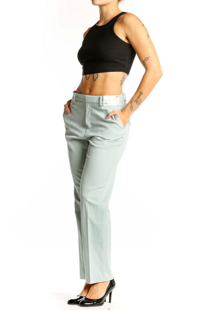 Front view of Uniqlo mint green straight-leg dress pants on model