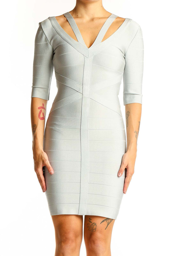 Front view of light gray Bebe bodycon dress with cutout neckline