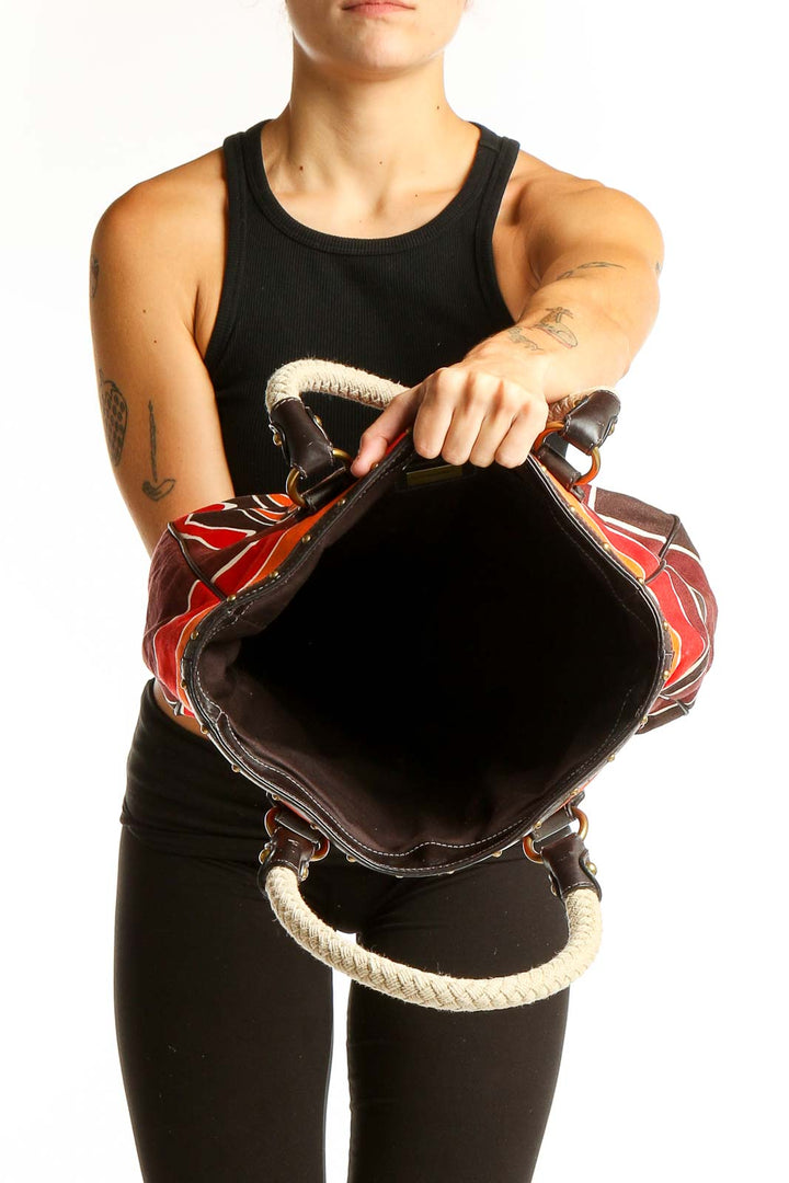 Side view of Red Floral Canvas Tote Bag worn by model