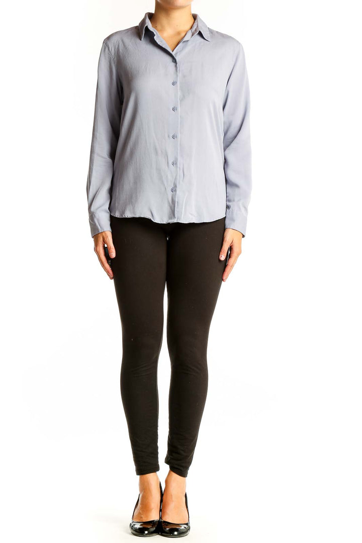Front view of Uniqlo light blue button-up long sleeve shirt