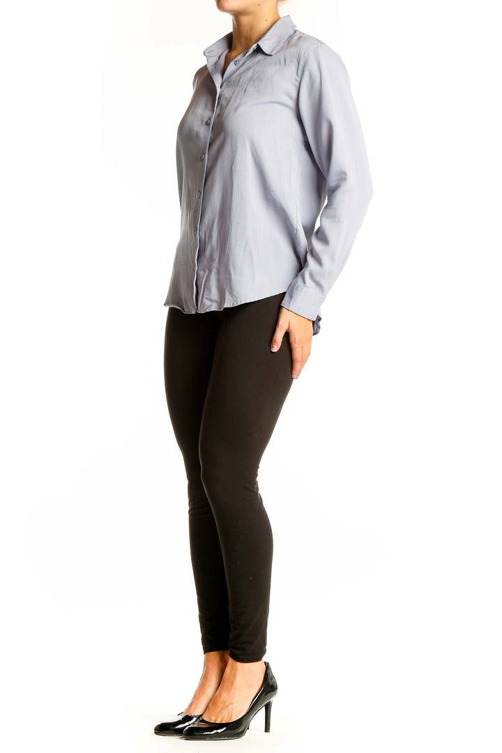 Front view of Uniqlo light blue button-up long sleeve shirt