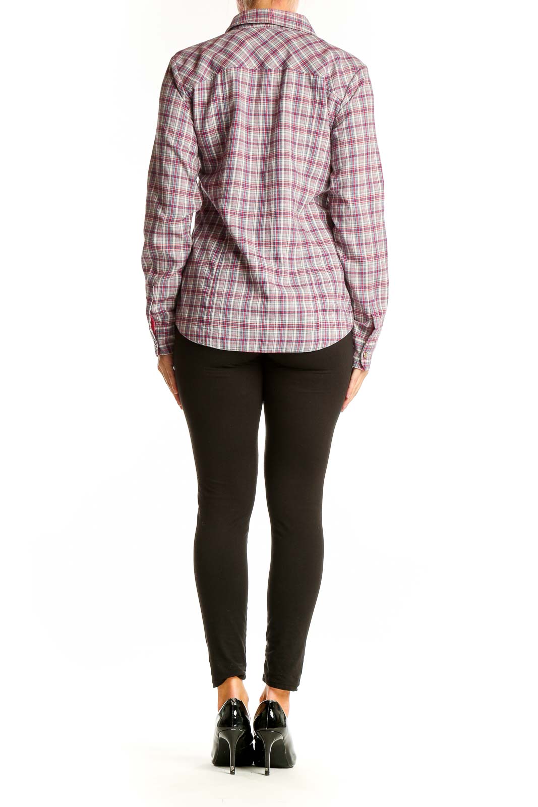 Side view of woman wearing Orvis pink plaid polyester button-up shirt with black pants