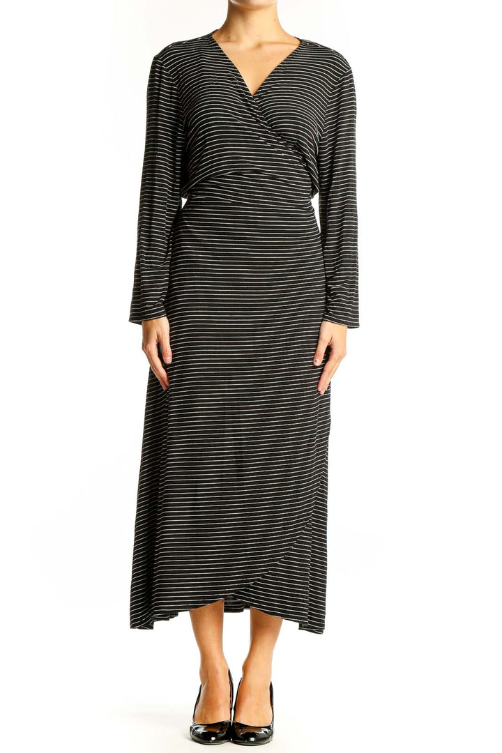 Front view of Gap black striped wrap midi dress with V-neck