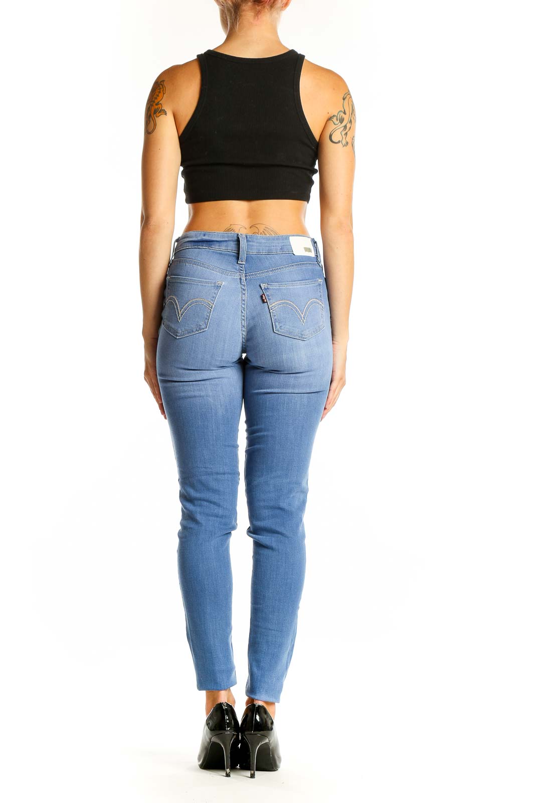 Back view of Levi's light blue skinny jeans on model