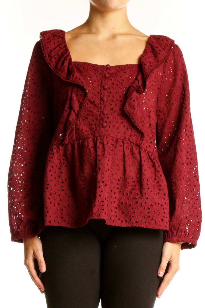 Front view of Madewell burgundy eyelet lace peplum blouse with square neckline and ruffle detail