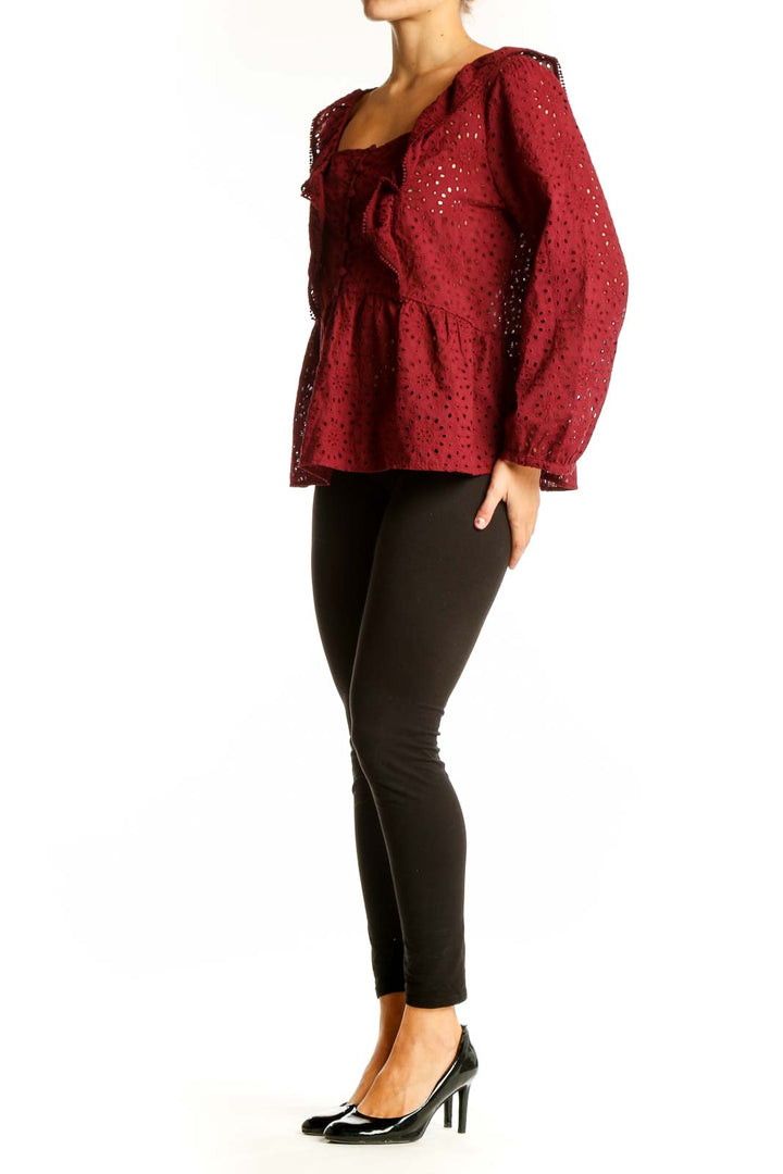 Front view of Madewell burgundy eyelet lace peplum blouse with square neckline and ruffle detail