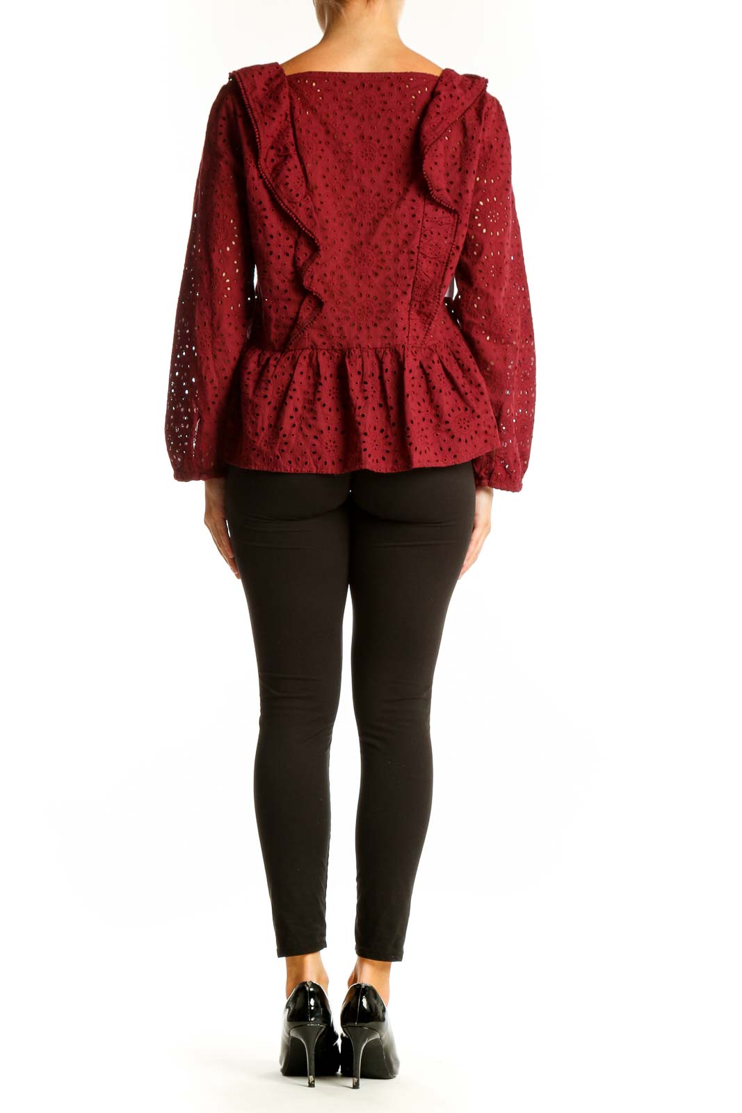 Side view of Madewell burgundy eyelet lace peplum blouse showing long balloon sleeves and peplum waist