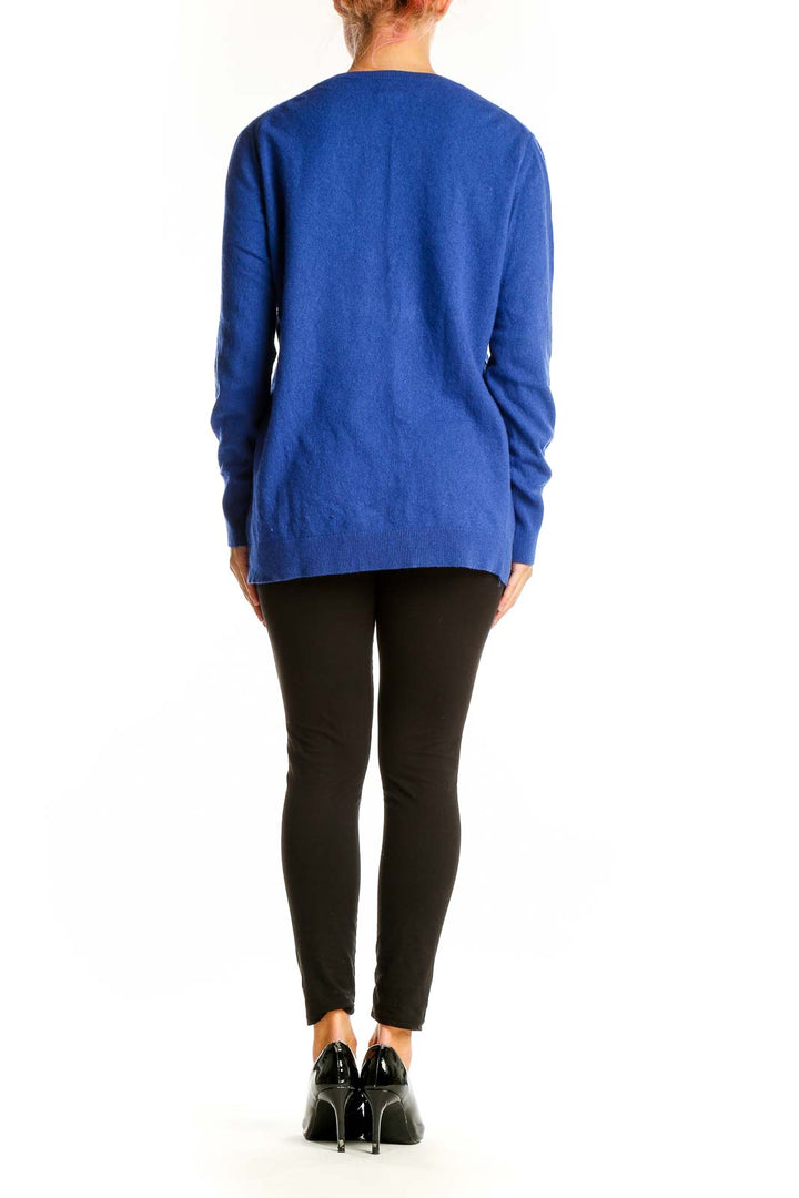 Side view of blue cashmere blend crewneck sweater from Banana Republic on model