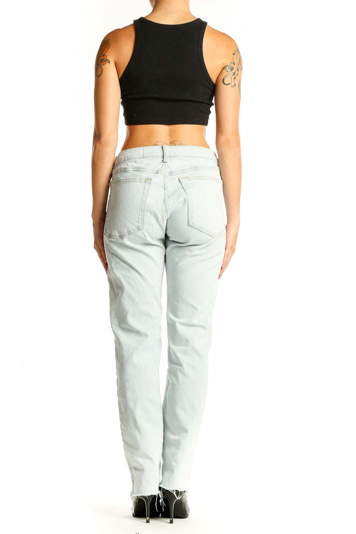 Back view of Rag & Bone light blue straight leg jeans on model