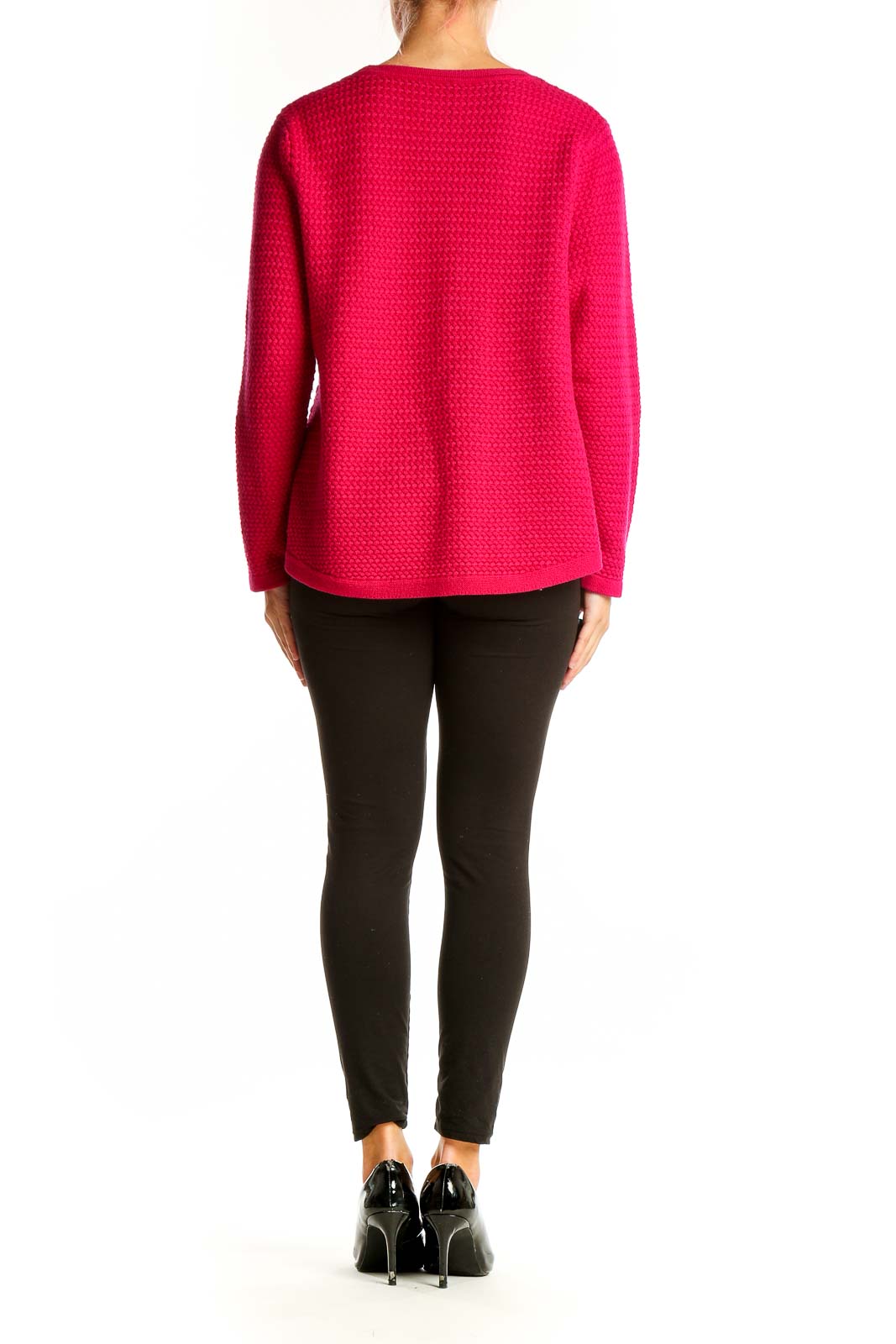 Side view of woman wearing hot pink textured knit sweater from Talbots with black pants