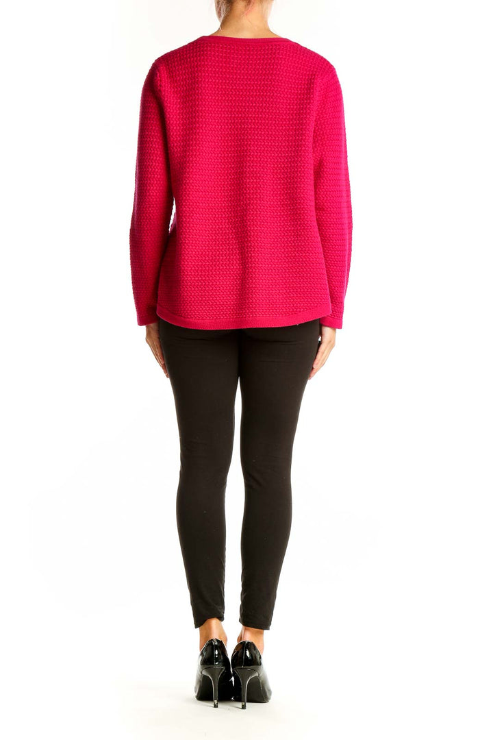 Side view of woman wearing hot pink textured knit sweater from Talbots with black pants