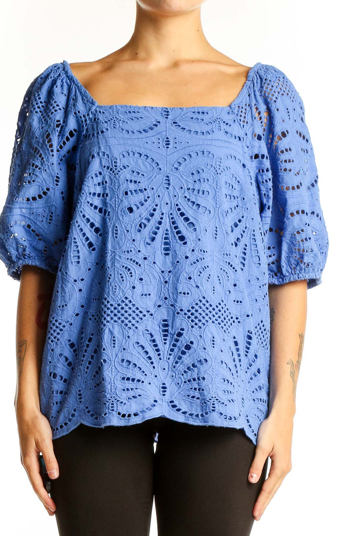 Front view of blue eyelet lace cotton blouse with square neckline and puffed sleeves