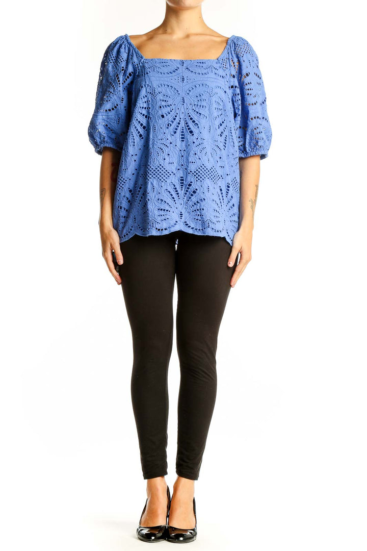 Front view of blue eyelet lace cotton blouse with square neckline and puffed sleeves