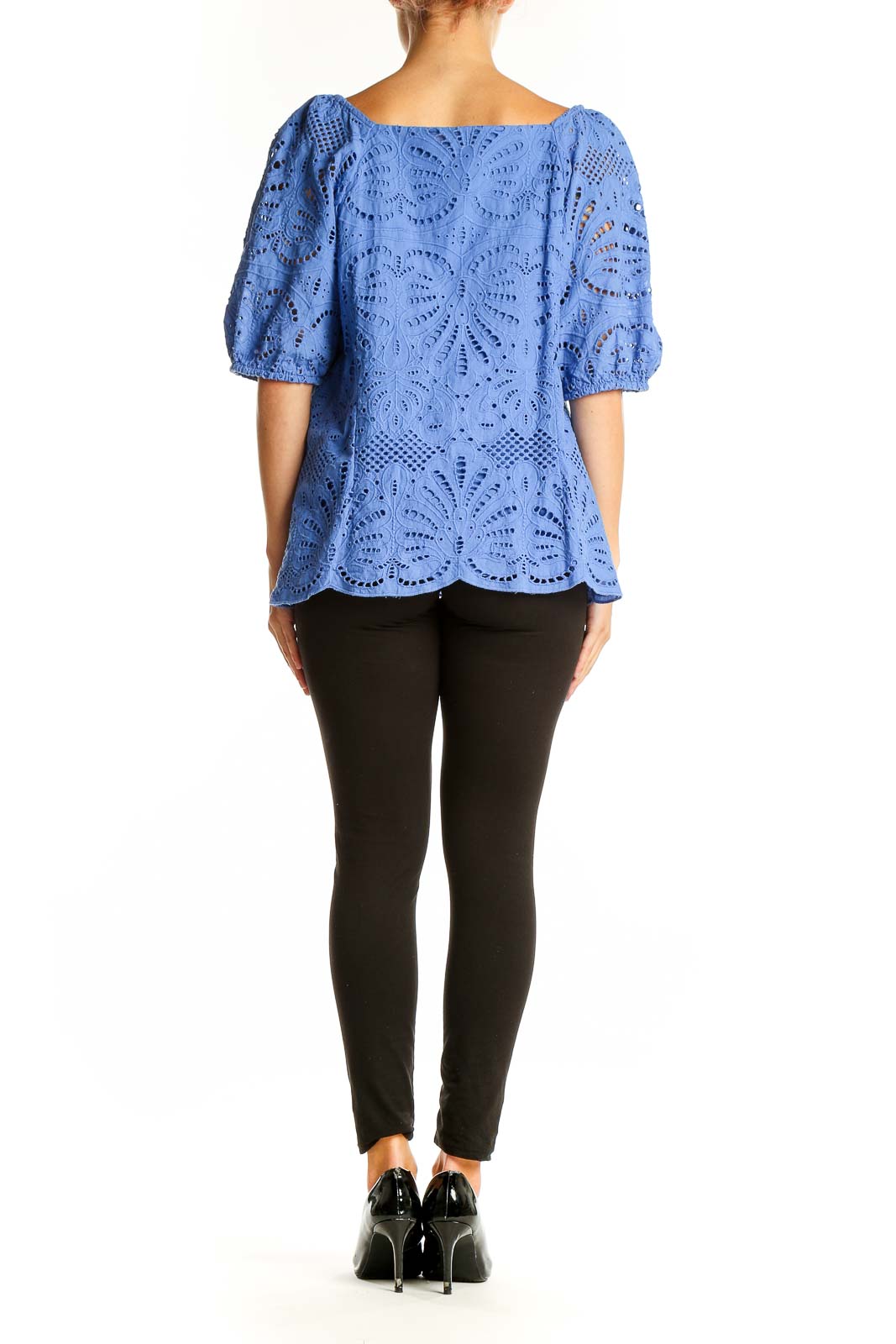 Side view of blue eyelet lace cotton blouse showing intricate pattern and relaxed fit