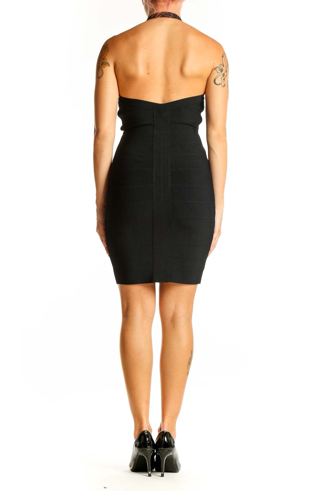 Side view of black Guess bodycon dress showing figure-hugging silhouette