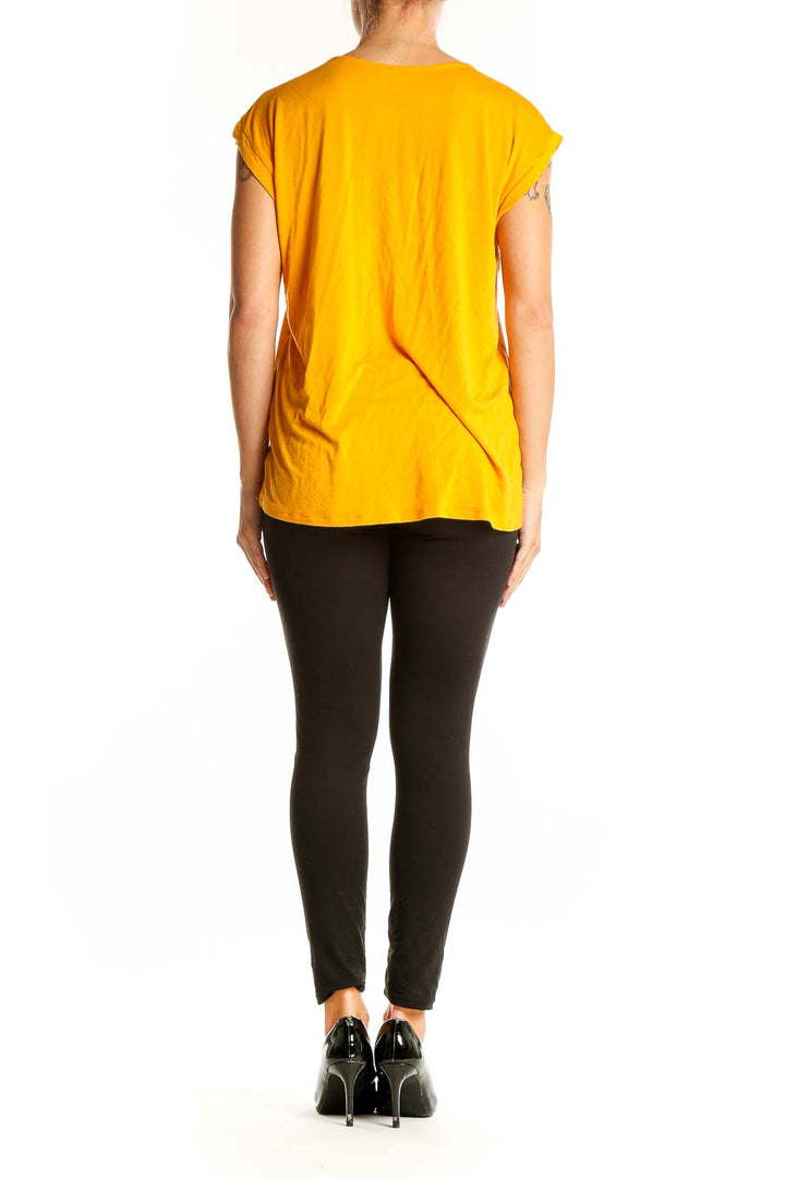 Side view of yellow floral print short sleeve blouse by Papermoon