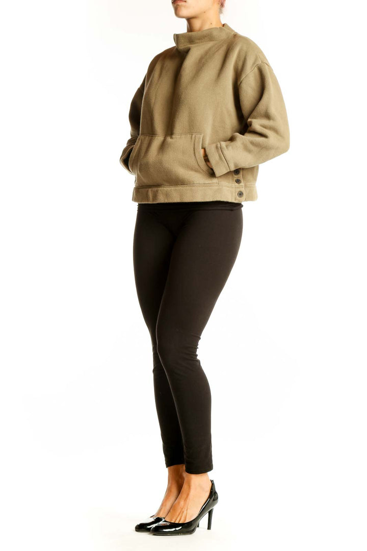 Front view of Madewell tan cropped mock neck sweatshirt with kangaroo pocket