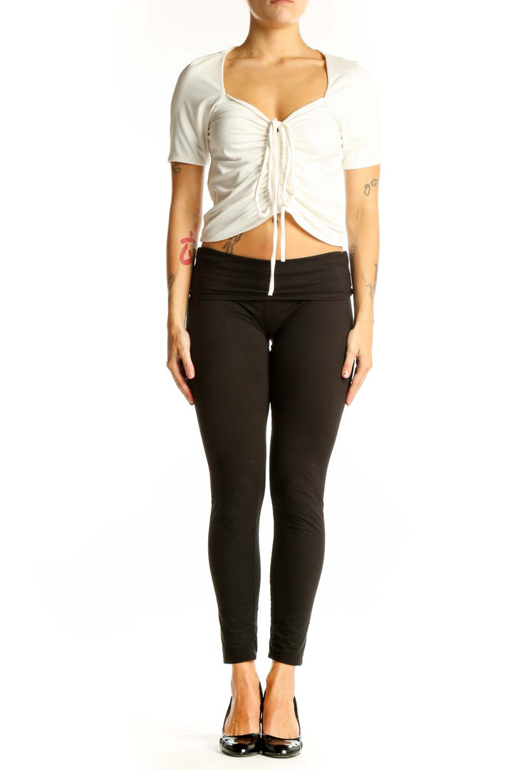 Front view of white ruched crop top with drawstring detail
