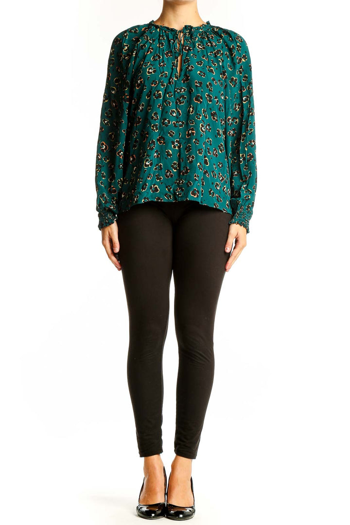 Front view of teal leopard print blouse with long sleeves and keyhole neckline