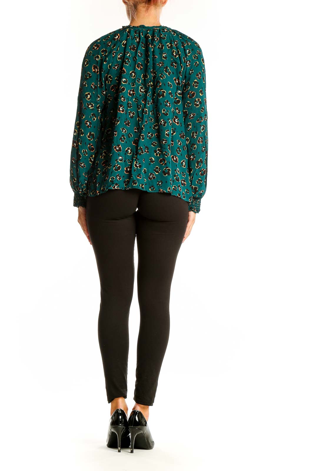 Back view of teal leopard print blouse showing relaxed fit and long sleeves