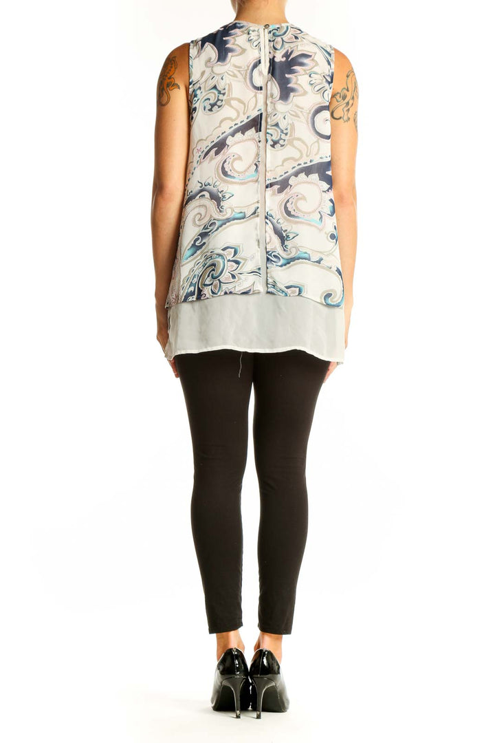 Side view of Daniel Rainn blue and white paisley sleeveless blouse showing layered design