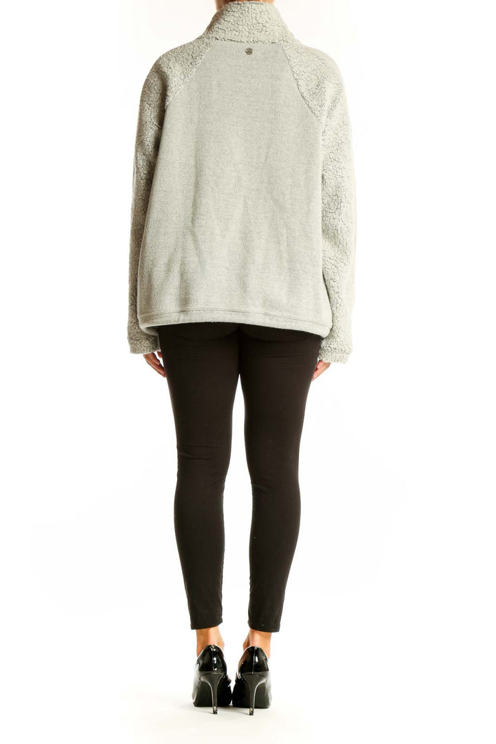 Side view of light gray prAna turtleneck sweater showing relaxed silhouette