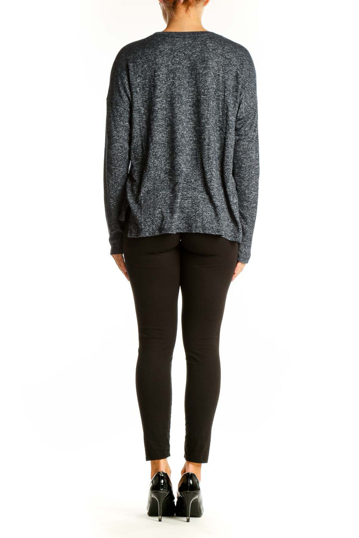 Side view of woman wearing gray heathered Abercrombie & Fitch long sleeve top