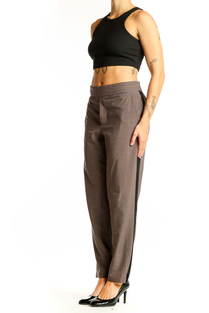 Front view of brown Athleta athletic pants with side stripes
