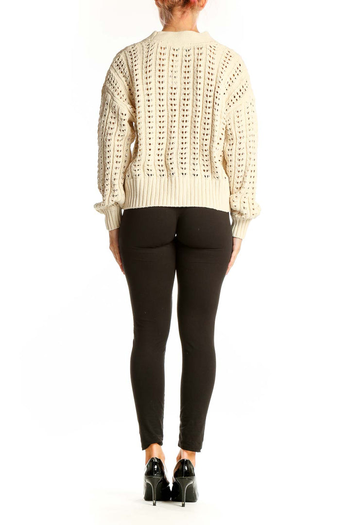 Back view of cream crochet knit cardigan from Gap showing full length and fit