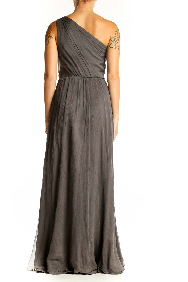 Side view of Amsale gray one-shoulder silk maxi dress showing flowing silhouette