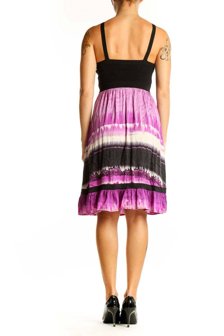 Side view of Bebe purple ombre tie-dye sundress showing flowy skirt