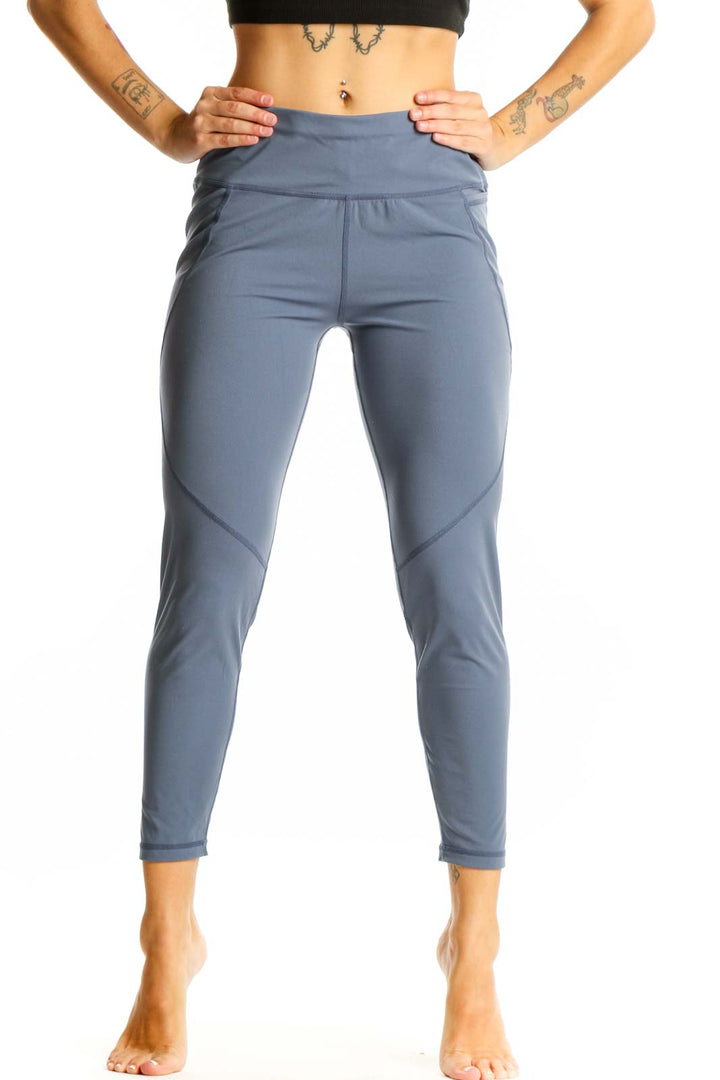 Front view of Sweaty Betty blue high-waisted performance leggings