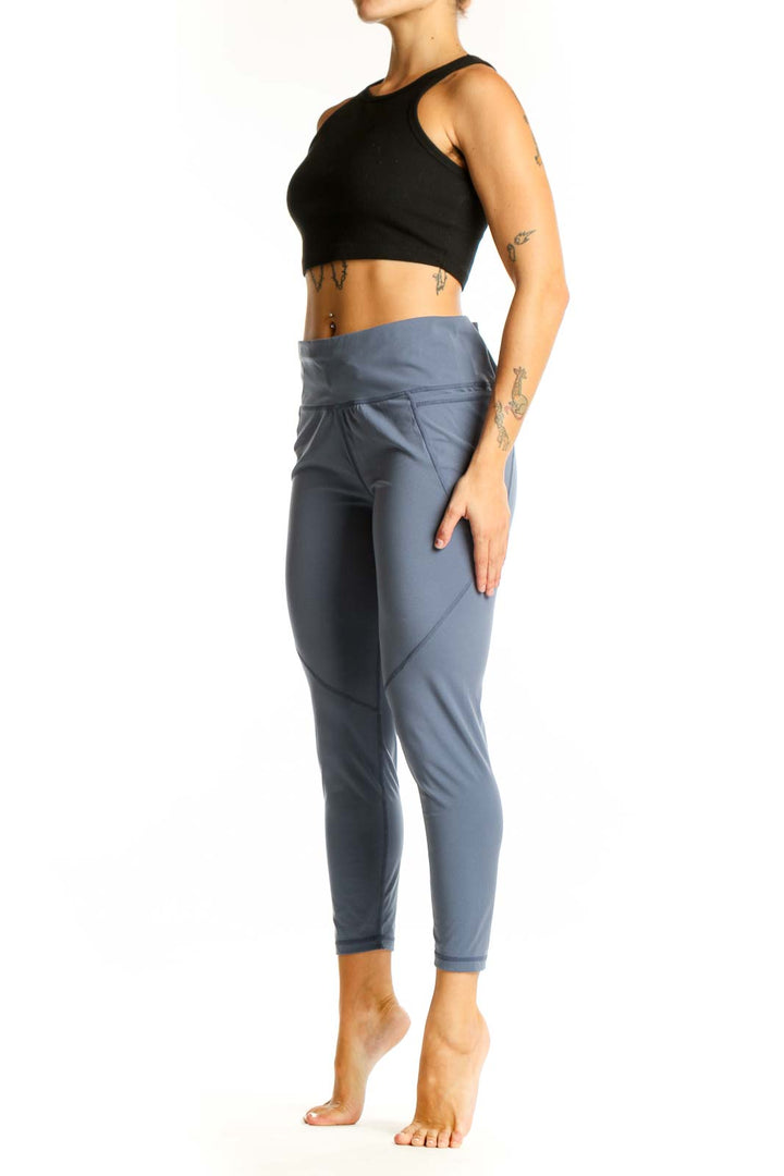 Front view of Sweaty Betty blue high-waisted performance leggings