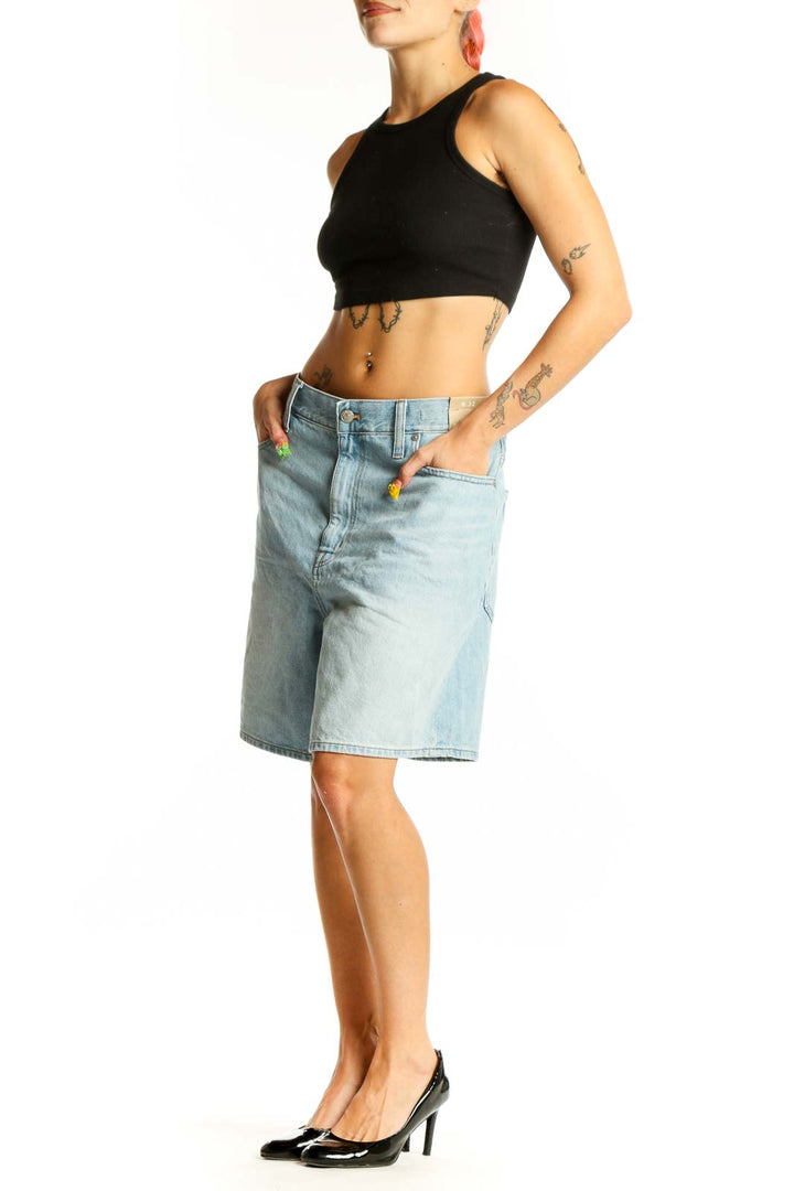 Front view of light blue Madewell denim Bermuda shorts