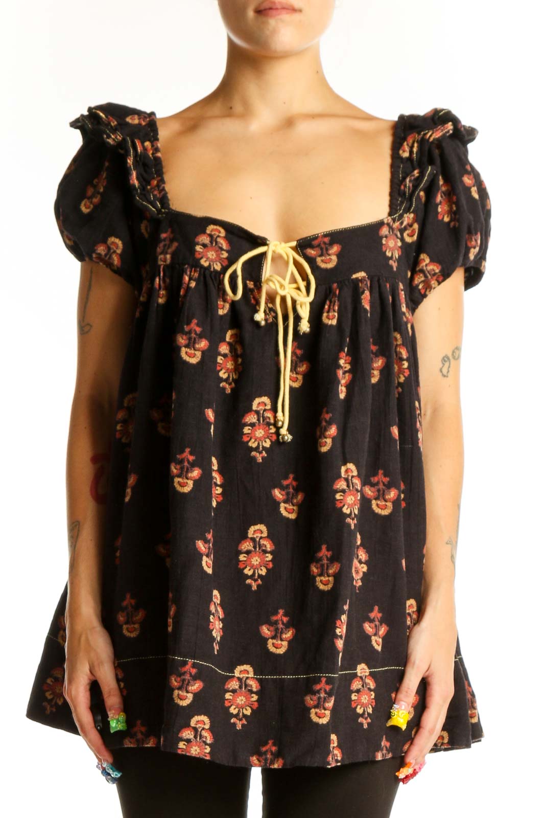 Front view of black floral puff sleeve babydoll top by Free People