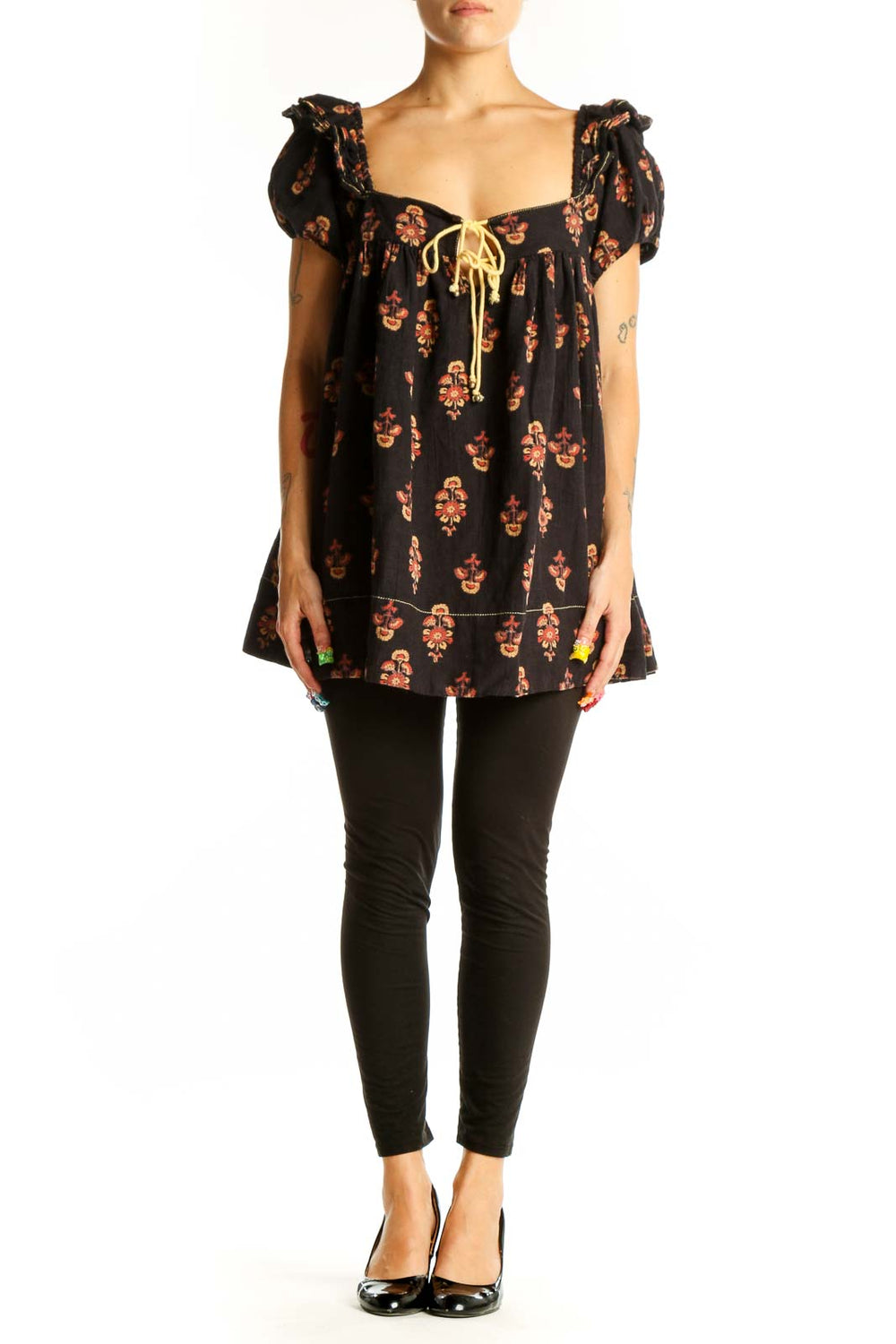 Front view of black floral puff sleeve babydoll top by Free People