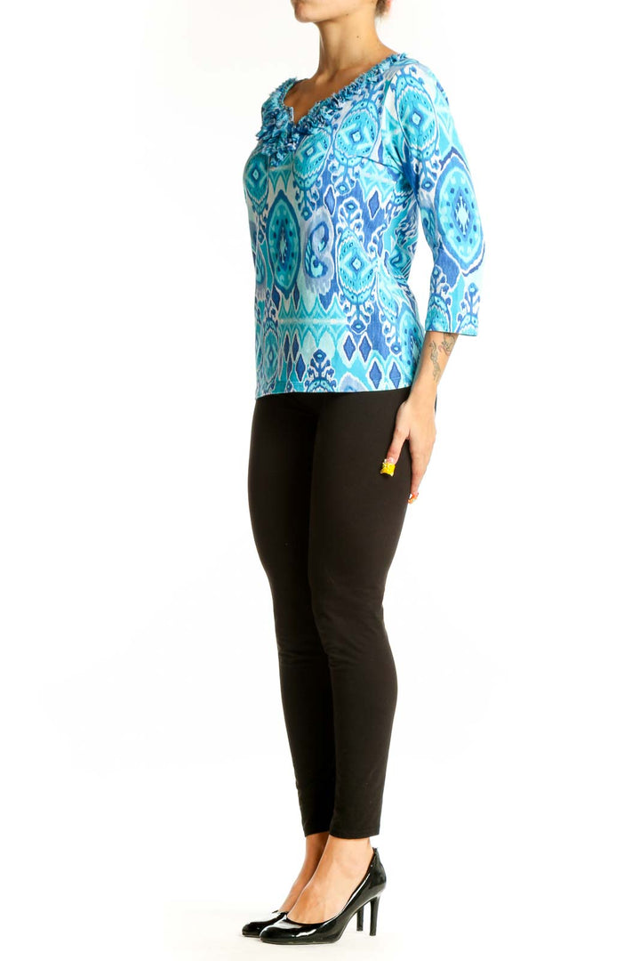 Front view of Ruby Rd. blue geometric print cotton top with ruffled neckline