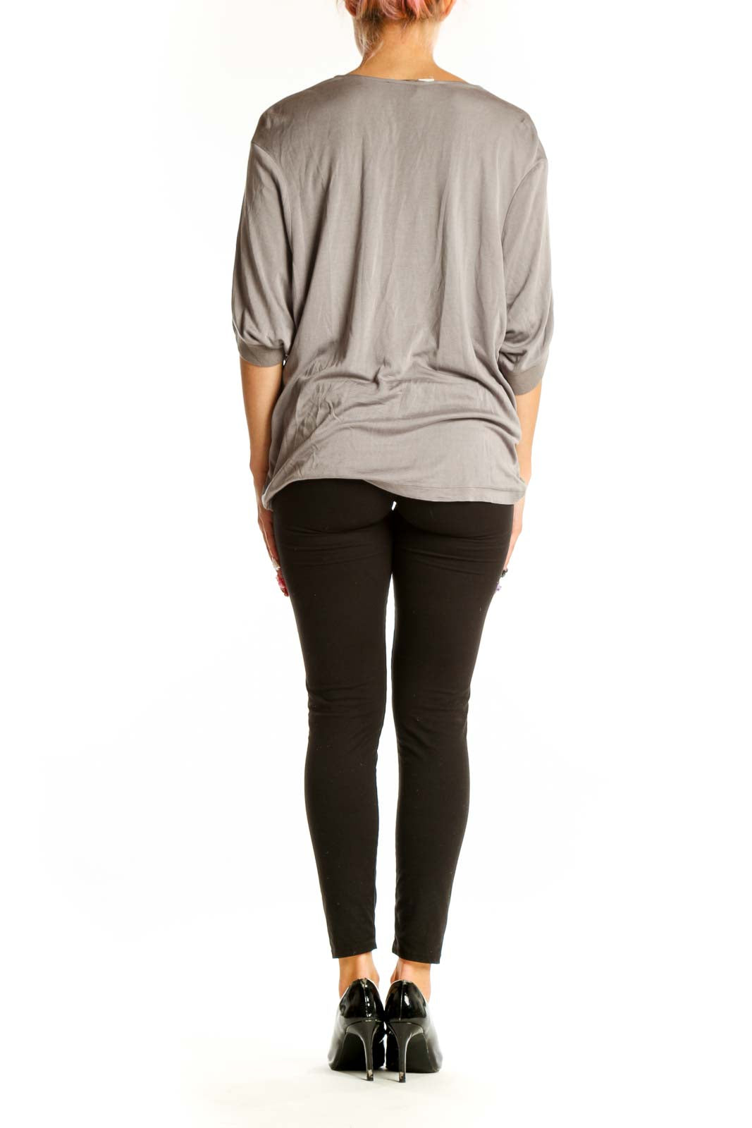 Side view of gray Halston Heritage oversized V-neck knit top on model