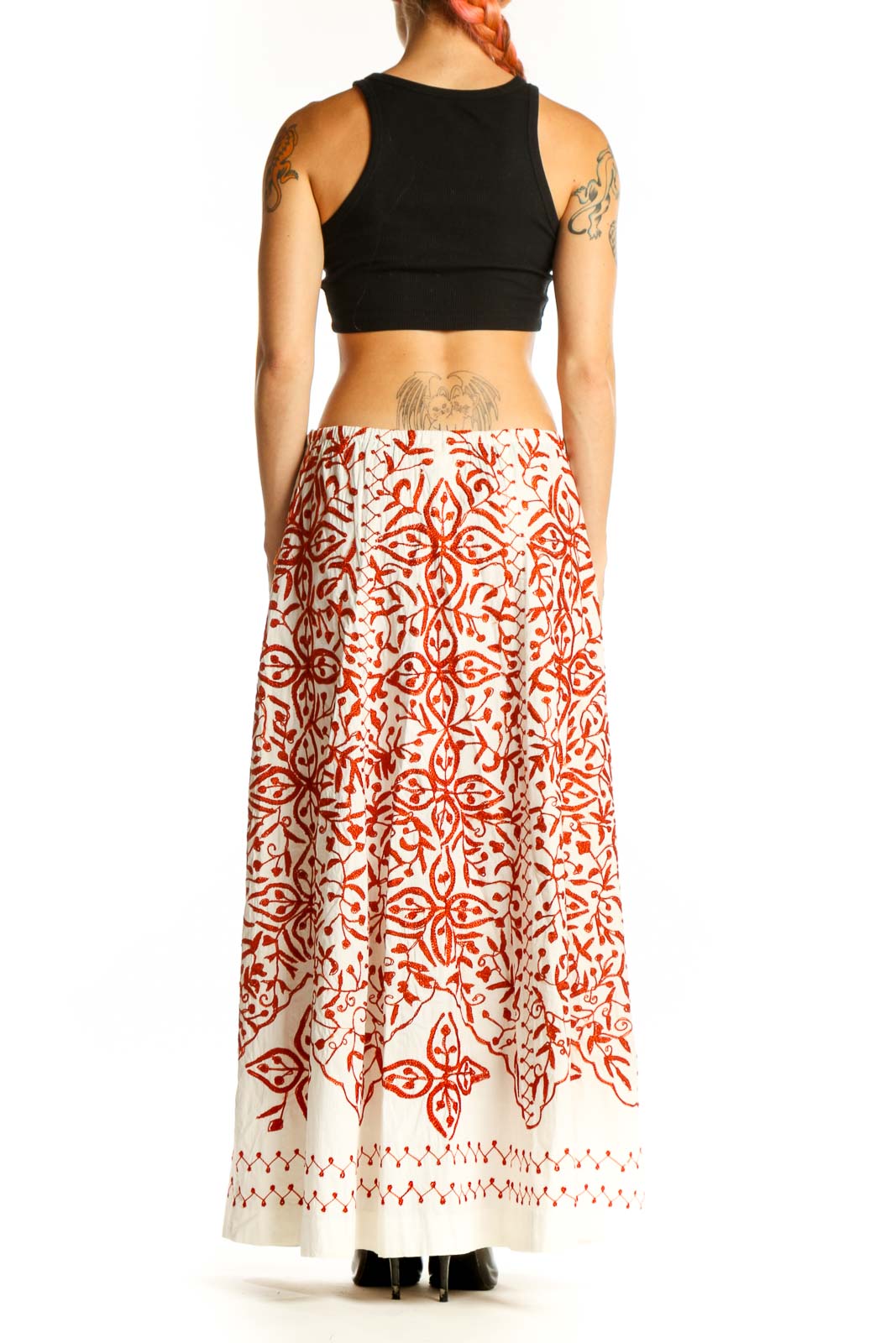 Side view of model wearing Soft Surroundings white and red floral maxi skirt
