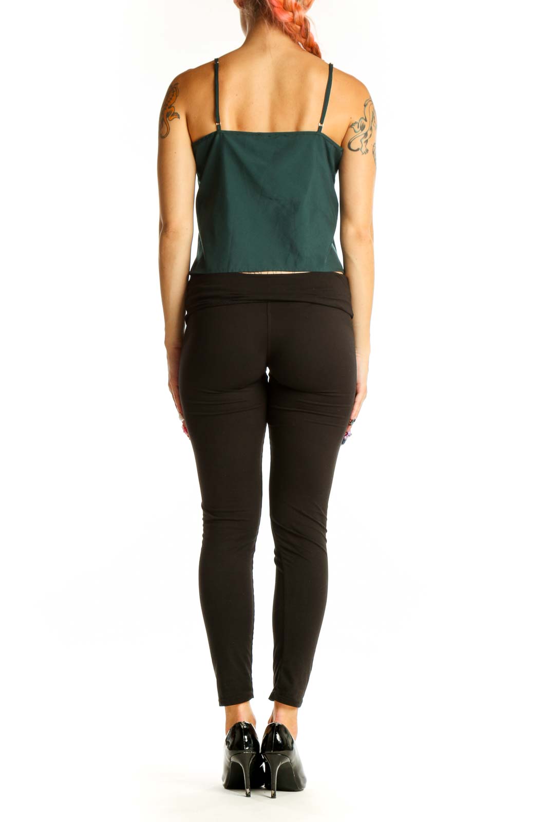 Side view of green polyester V-neck camisole top by Express with black pants