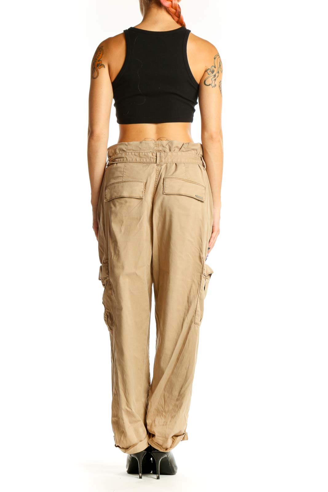 Side view of model wearing khaki cotton cargo pants with black crop top